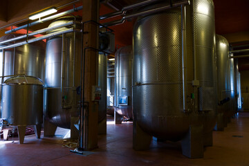 Fototapeta na wymiar Fermentation tanks in winery, Piedmont, Italy