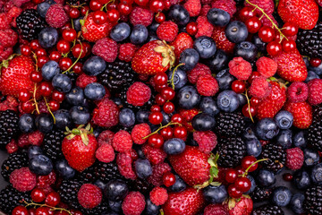 Various fresh summer berries backgrounds. Strawberry, blueberry, raspberry red currant and...