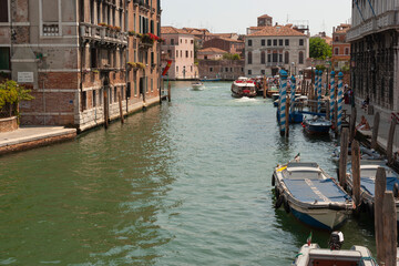 Buildings, boats, and gondolas in The Grand Canal, Venice, Italy