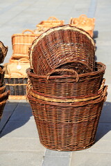 Brown baskets made of common osier usable for household appliances - for sale at a market