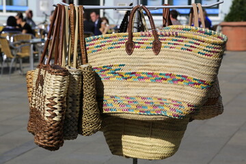 Handcrafted straw bags baskets sold at a market in Provence, Côte d´azur, France