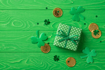 Top view photo of st patrick's day decorations shamrocks green giftbox with polka dot pattern...