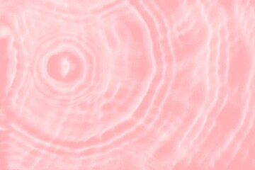 Abstract summer banner background Transparent pink clear water texture with ripples, splashes and bubbles.