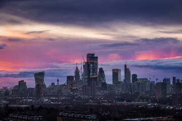 Skyline of the City of London, England, with colorful clouds during a rainy sunset