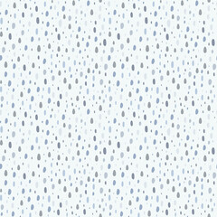 Doodle dots in soft blue palette, seamless pattern. Many small spots on a light background, rough polka dot style. Funny design for print