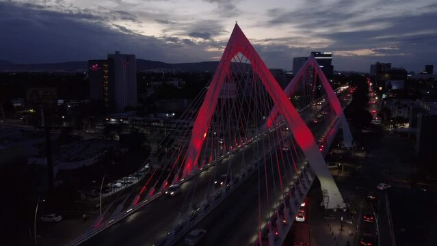 evening flying counter clockwise around Matute Remus Bridge in Guadalajara Mexico