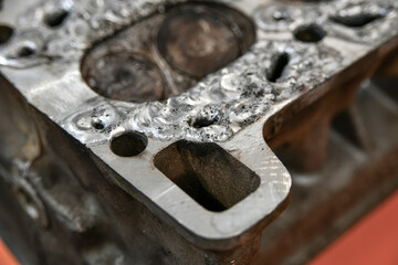 Removal of corrosion cavities on the surface of the cylinder head by welding and welding with argon.