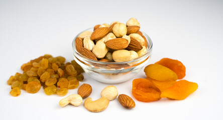 Healthy snack. Mix of dried fruits and nuts isolated on white background. Healthy food concept. Banner. Close-up.