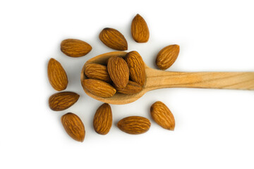 Top view of almond nuts in a wooden spoon. Healthy food concept. Close-up. Banner. Selective focus.
