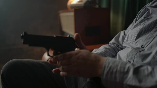 Special secret agent is reloading pistol gun. Spying or intelligence gathering. Espionage concept. 