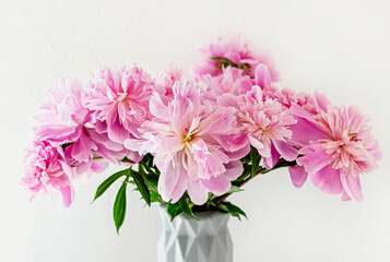 Still life with a beautiful bouquet of pink peony flowers. Close up. Selective focus.