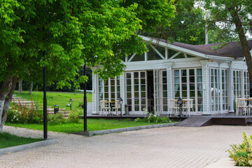 Naklejka premium Summer south street white cafe glass wall