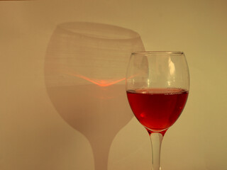 Glass of red wine with shadow
