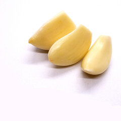 Fresh whole peeled garlic gloves isolated
