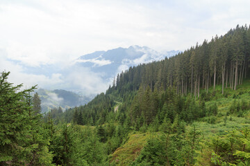 Panorama view with alpine mountains and clouds in Salzburgerland, Austria