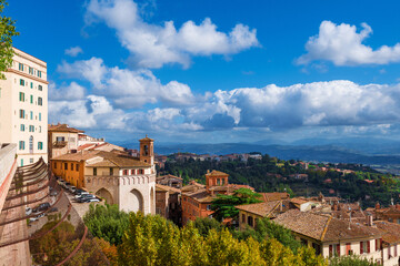 Fototapeta premium View of Perugia medieval historic center with ancient Sant'Ercolano church and Umbria countryside from city panoramic terrace