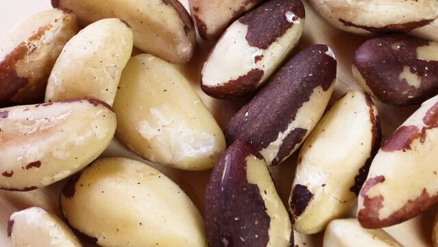 Closeup of Brazil nuts rotating.
