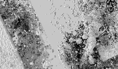3d render of monochrome black and white abstract art 3d background in explosion process based on small aluminum dust metal balls spheres or bubbles particles on grey background