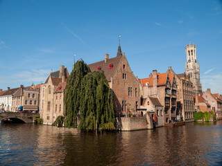 Bruges canal with Belfort tower in background