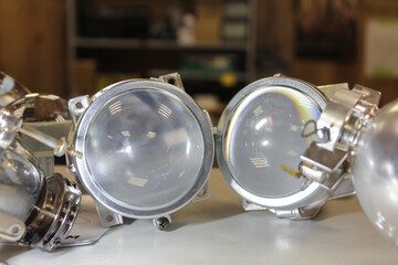 LED lenses taken from a car headlight close-up.  Repair and tuning of cars. Headlight repair. Restoration of automotive optics.
