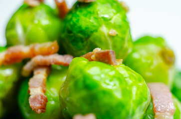 Tasty brussels sprouts with smoked bacon lardons and salted butter