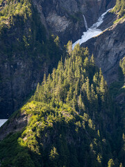 Sunrise on the mountains towering over Enchanted Valley in Olympic National Park, forest covered ridges.