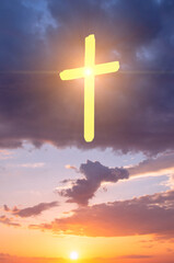 Sunset photo with the concept of a Christian cross in the sky, symbolizing faith in God.
