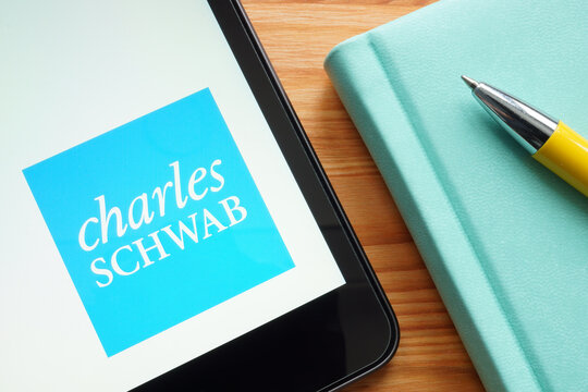 KYIV, UKRAINE - January 27, 2022. Charles Schwab logo on the tablet.