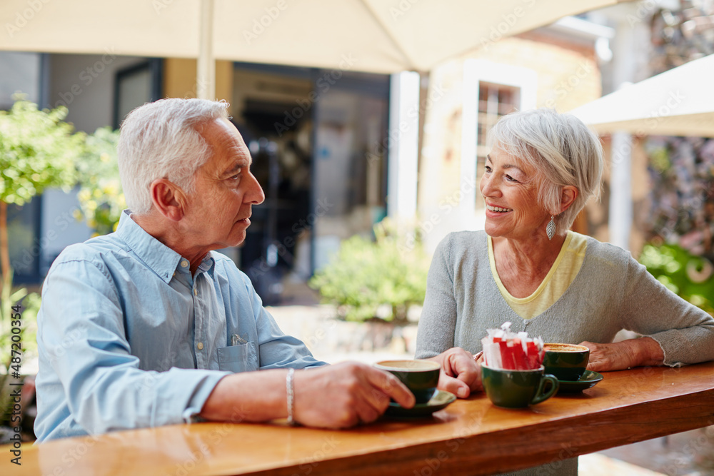 Canvas Prints having coffee after meeting at an online dating site. shot of a senior couple having coffee at a caf