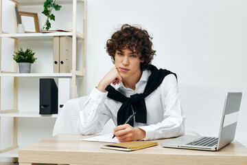 man sitting on the couch at the table in front of a laptop Lifestyle technology
