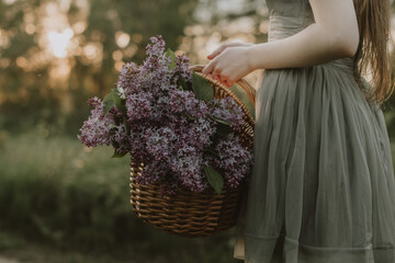 person holding bunch of lilac - Powered by Adobe