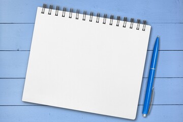Blank 2022 desk calendar on wooden background.