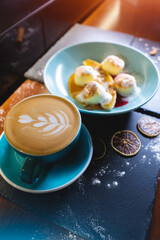 fresh coffee with cheese pancakes with banana, peanut butter and raspberry sauce
