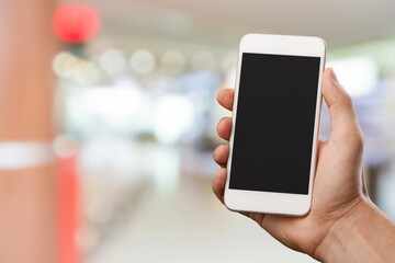 Hand with smartphone with empty blank screen