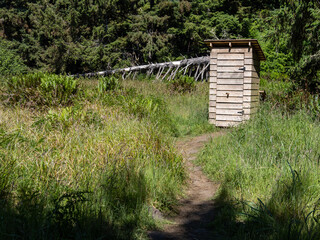 A wooden privy at a campsite in Olympic National Park.