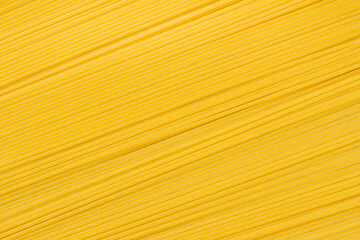 Spaghetti, raw pasta, diagonal background. Italian cuisine concept