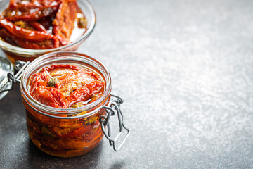 Sun dried tomatoe. Pickled tomatoes jar.