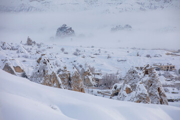 Pigeon Valley and Cave town in Goreme during winter time. Cappadocia, Turkey. Open air museum, Goreme national park. Heavenly landscape