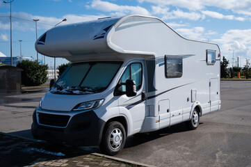 White house on wheels in the parking lot.