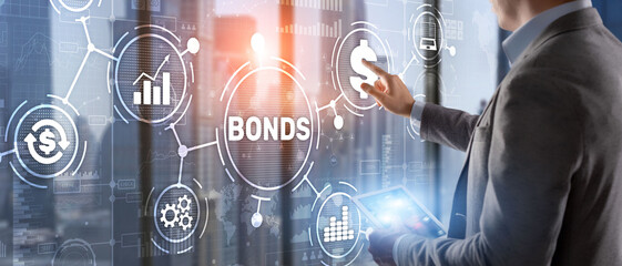 Fototapeta na wymiar Businessman clicks a bonds virtual screen. Bond Finance Banking Technology concept. Trade Market Network