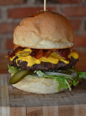 burger with cheese , onion and vegetables