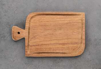 Empty wooden board over stone background with copy space