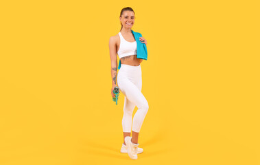Fototapeta na wymiar sport woman with water bottle on yellow background