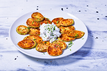 Fried zucchini slices with tzatziki