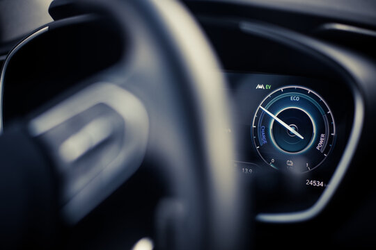 Digital dashboard of a new car, showing power and charge