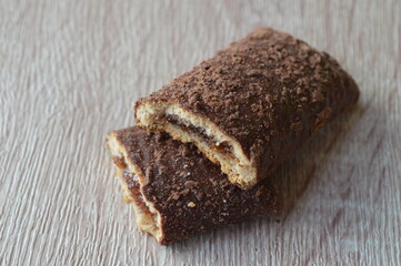 homemade mini strudels stuffed with cherry jam on a wooden background