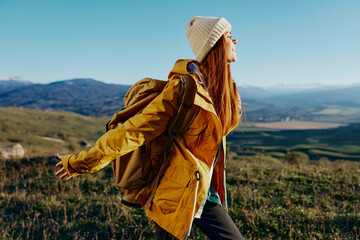 woman mountain top nature travel adventure relaxation
