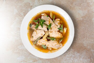 Tasty noodle soup with vegetables in bowl on the desk