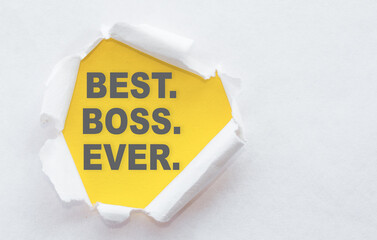 A white package paper torn to reveal yellow panel with text BEST BOSS EVER