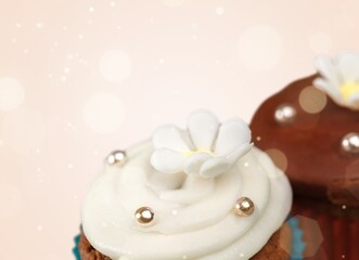 Many different cupcakes with decorations and toppings in a pastry shop concept